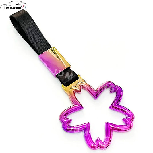 Strap decorativo para autos en forma de sakura 🚗🌸