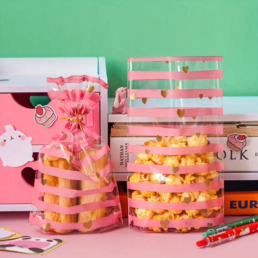 Set de 100 Bolsas Transparentes con Diseño de Rayas Rosadas y Corazones Dorados