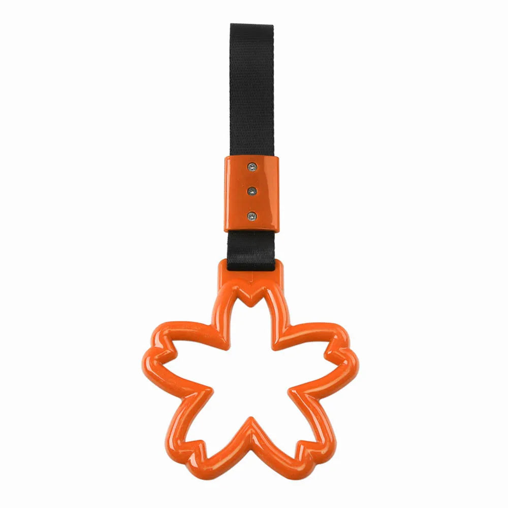 Strap decorativo para autos en forma de sakura 🚗🌸