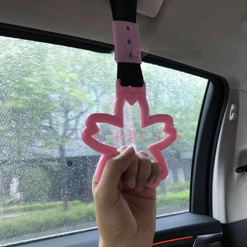 Strap decorativo para autos en forma de sakura 🚗🌸