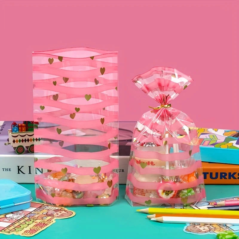 Set de 100 Bolsas Transparentes con Diseño de Rayas Rosadas y Corazones Dorados
