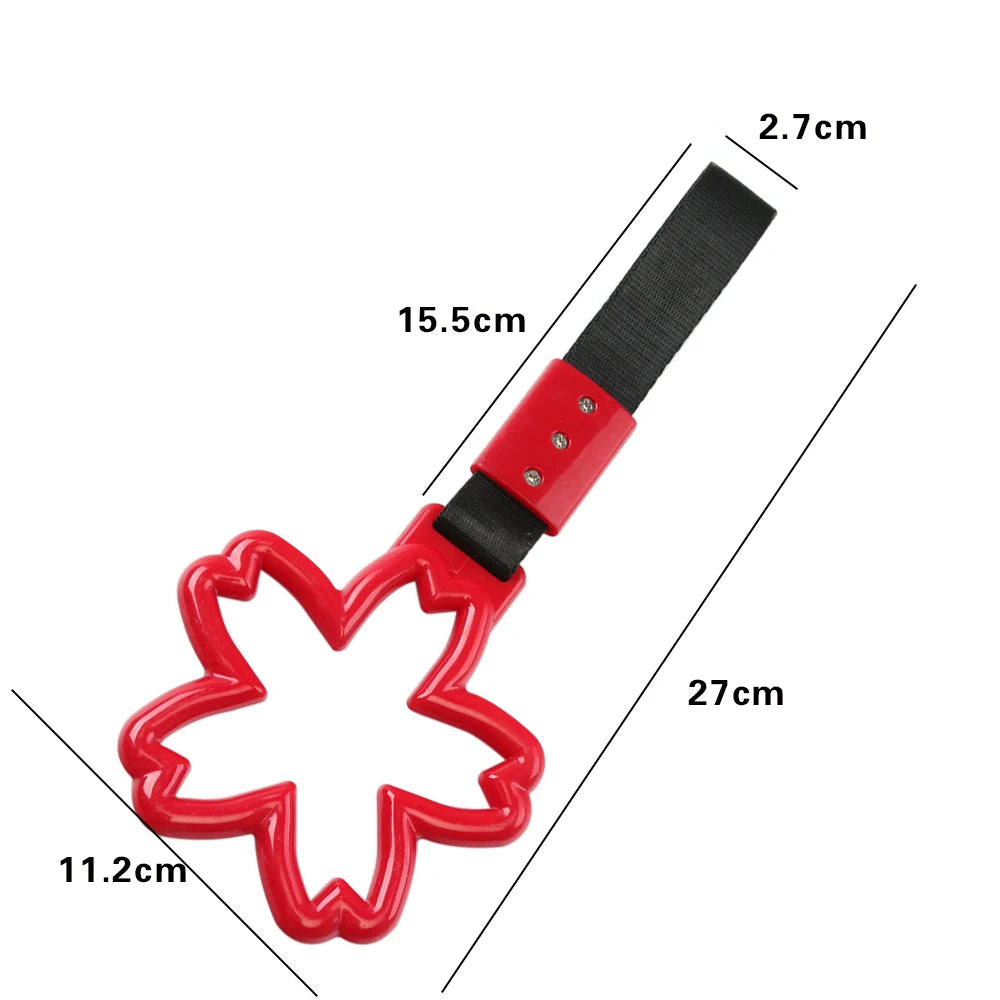Strap decorativo para autos en forma de sakura 🚗🌸