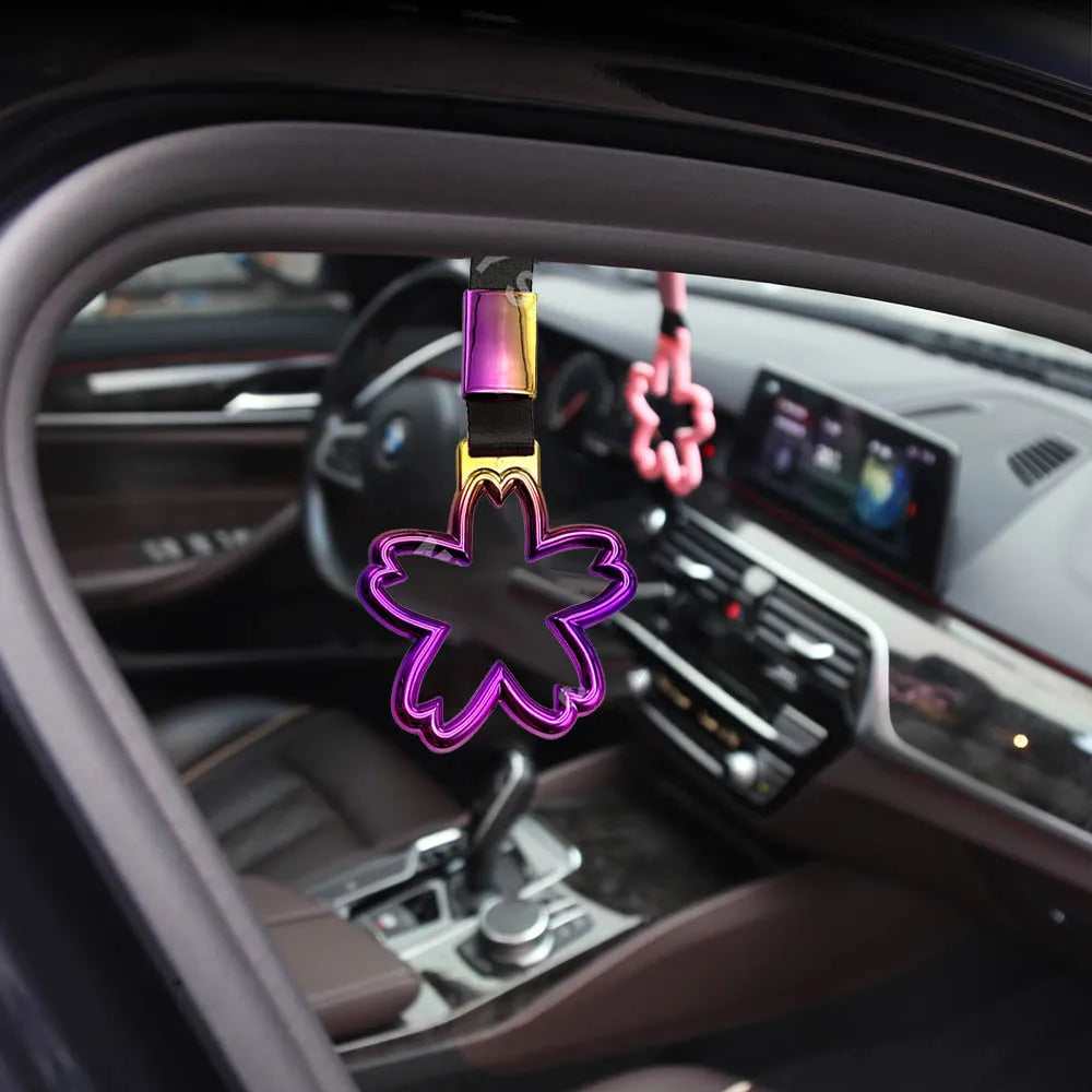 Strap decorativo para autos en forma de sakura 🚗🌸