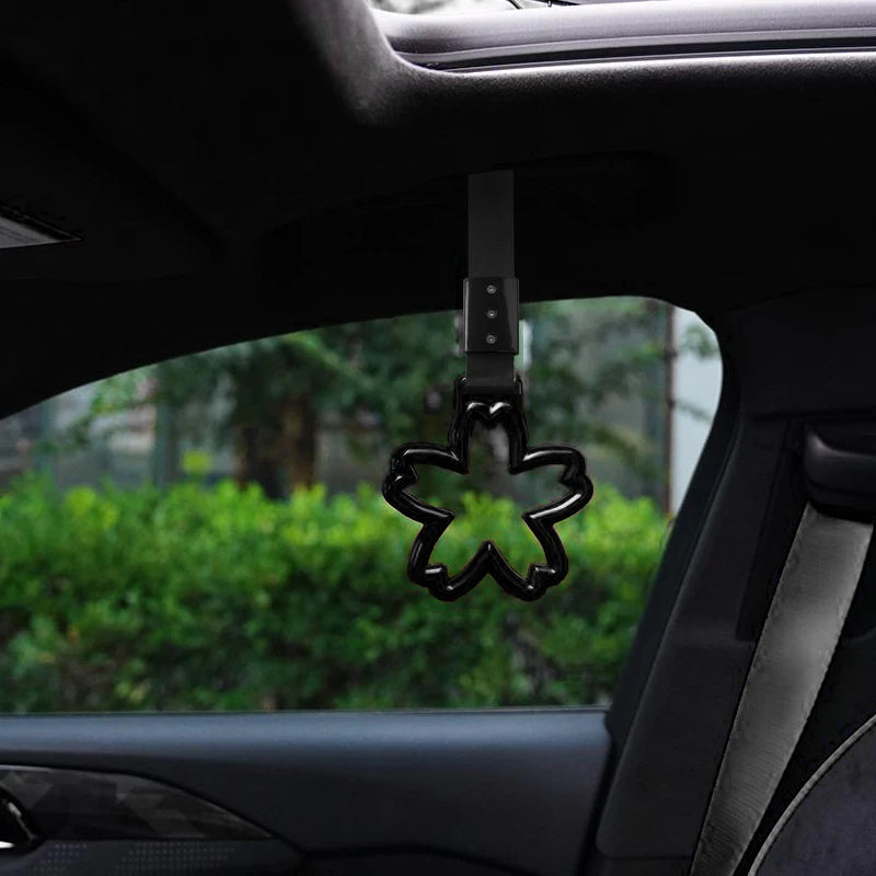 Strap decorativo para autos en forma de sakura 🚗🌸